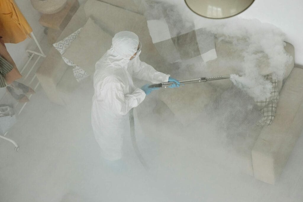 Professional antimicrobial carpet treatment application by technician in Rohnert Park home