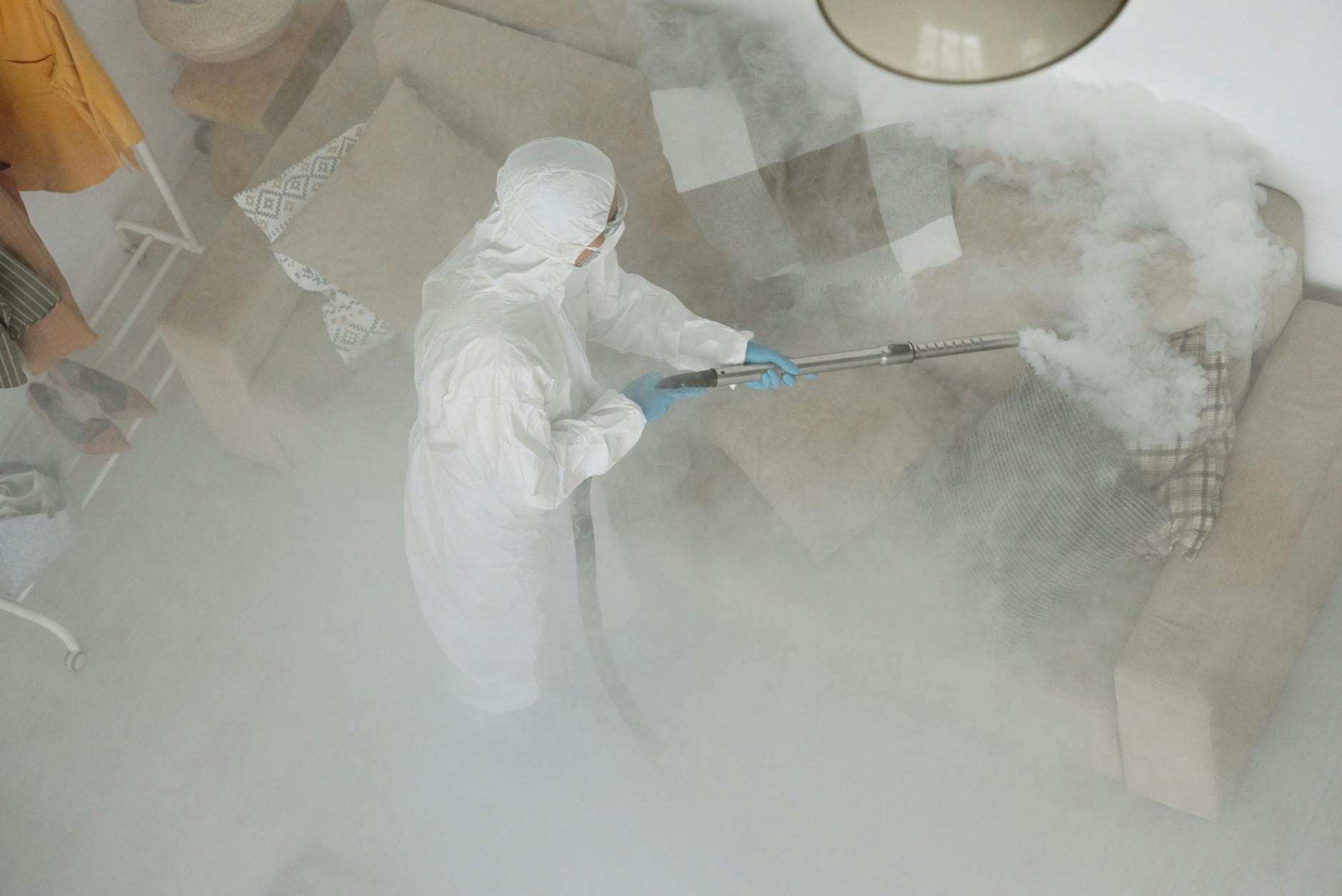 Professional antimicrobial carpet treatment application by technician in Rohnert Park home